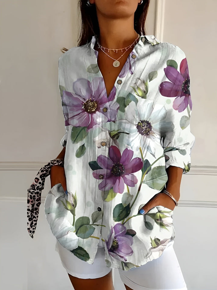 Fashionable women's floral print oversized button-down top. Relaxed fit blouse for stylish summer casual wear.