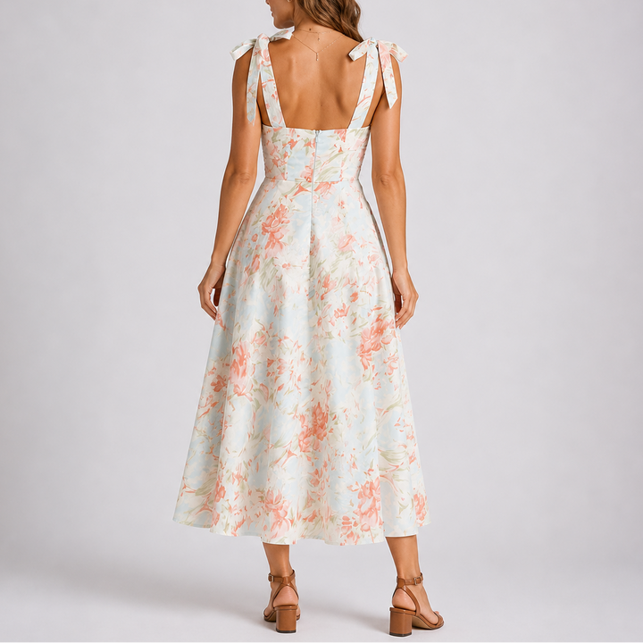 Women's summer floral print ruched midi dress featuring adjustable tie-shoulder straps & A-line cut for elegance.