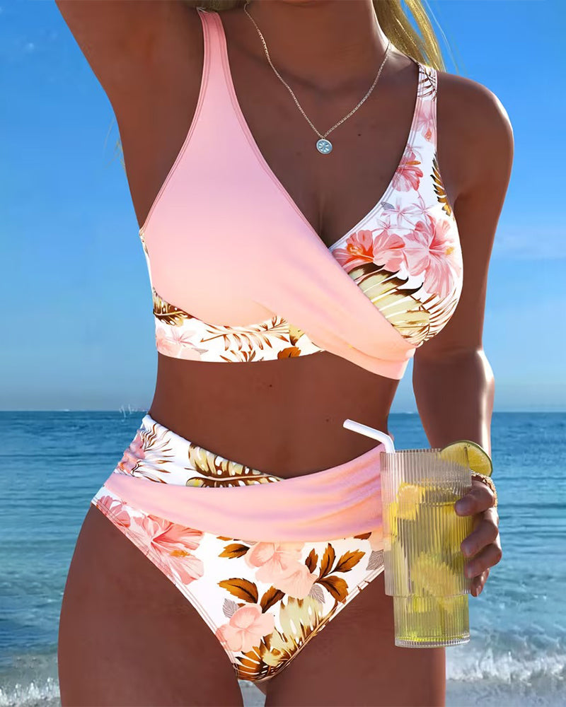 Women's floral print split bikini set, stylish two-piece swimwear for summer beach.