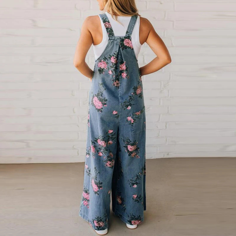 Trendy women's floral print wide leg dungaree jumpsuit. Fashionable boho-inspired casual wear, perfect for warm weather.