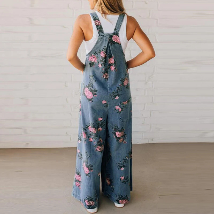 Trendy women's floral print wide leg dungaree jumpsuit. Fashionable boho-inspired casual wear, perfect for warm weather.