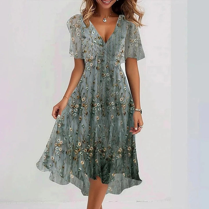 Feminine women's V-neck wrap midi dress, floral print flutter sleeves. Perfect casual elegant summer dress.