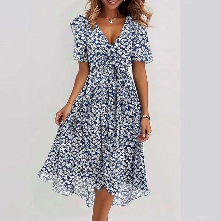 Elegant women's floral wrap midi dress, V-neck, flutter sleeves. Ideal for summer parties & casual events.