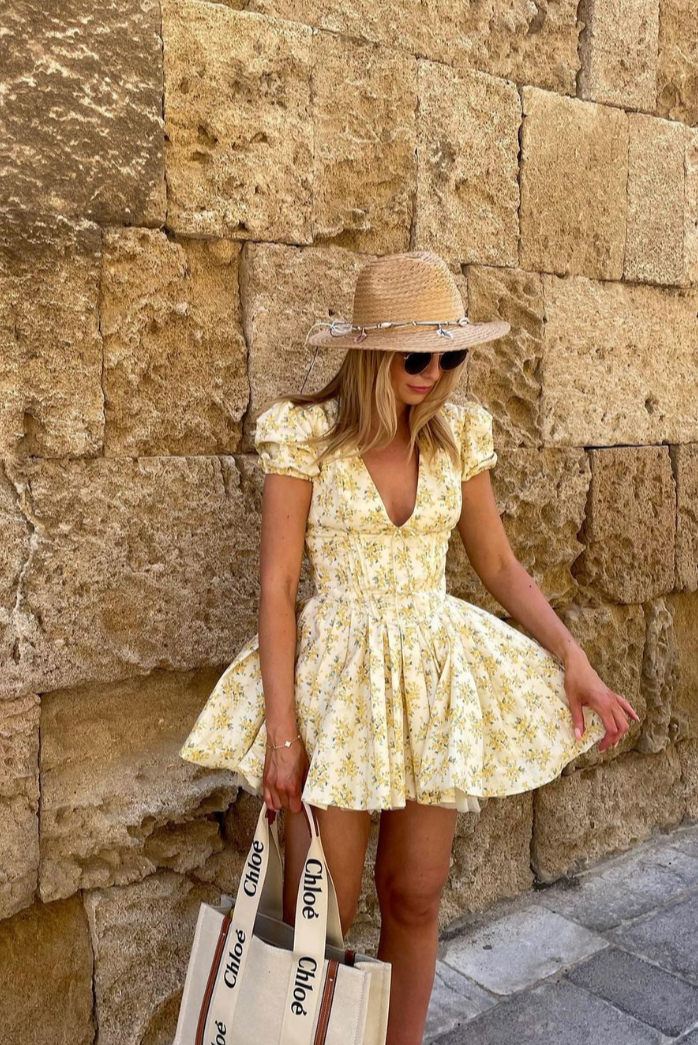 Elegant casual women's floral puff sleeve mini dress featuring a stylish open back.