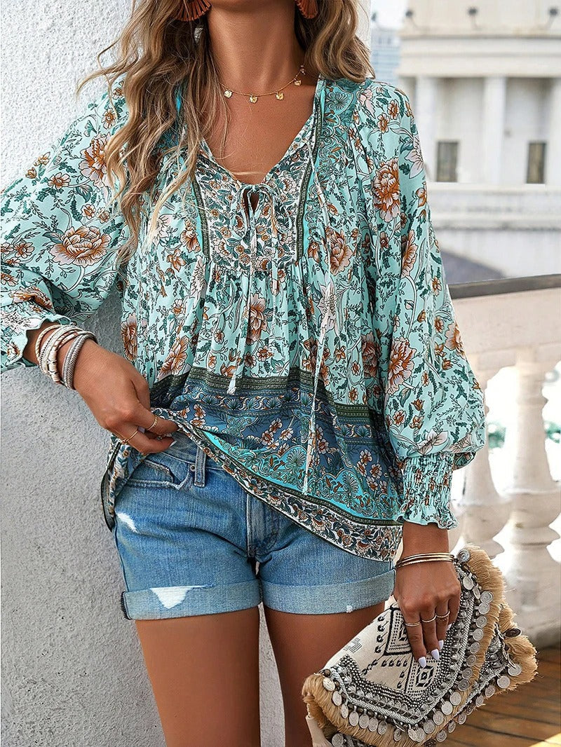 Stylish women's lightweight floral puff sleeve top, comfortable for summer casual outfits.