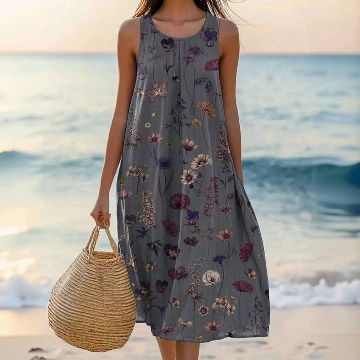 Comfortable women's floral midi swing dress with scoop neck, sleeveless design, ideal for summer vacation.