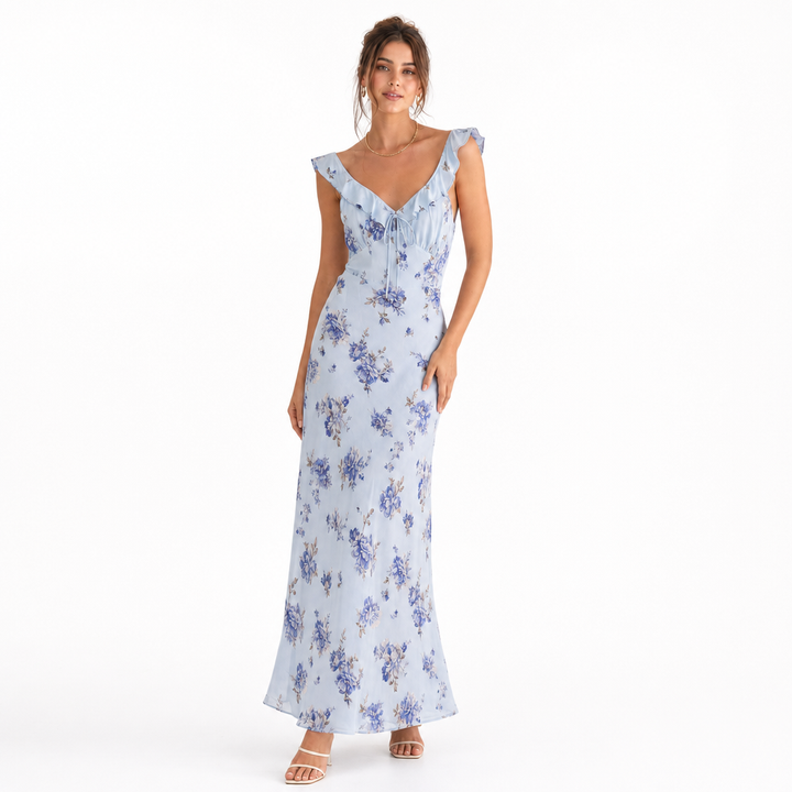 Vibrant floral print women's beach dress with sleeveless & backless design, great for vacation.