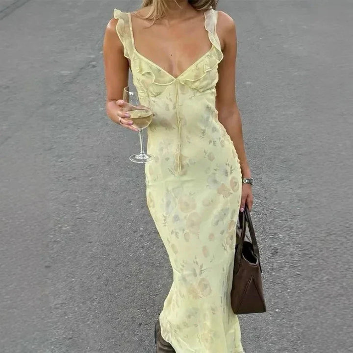 Fashionable women's floral summer beach dress, sleeveless, backless, ideal for warm weather.