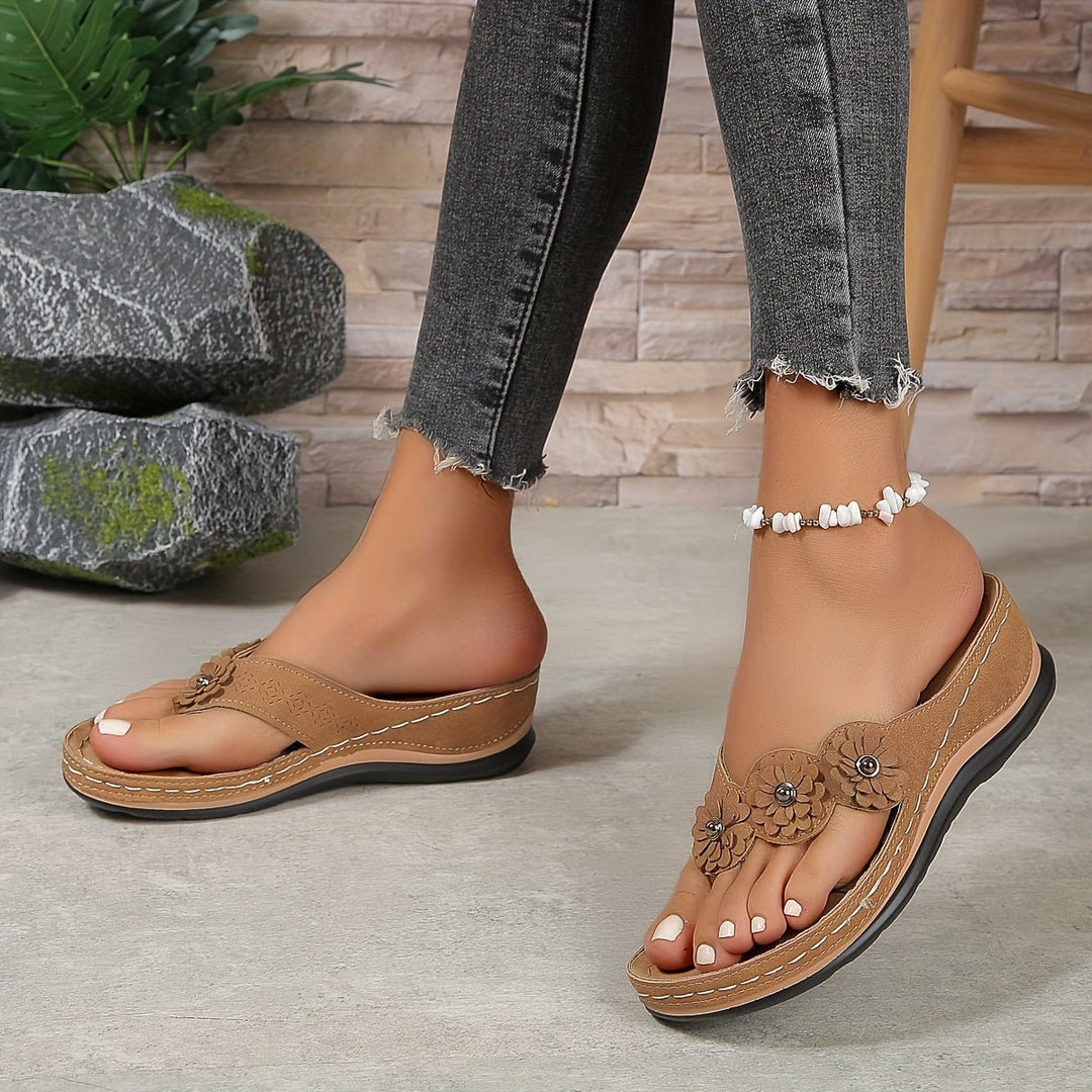 Comfortable women's slip-on floral wedge sandals. Perfect platform summer footwear for casual style.