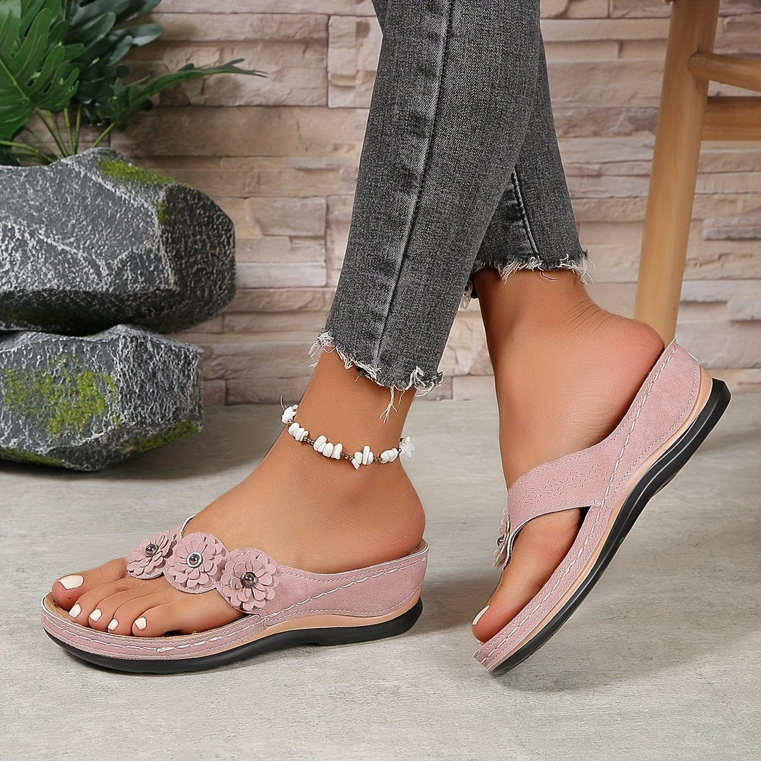 Casual women's floral slip-on sandals. Comfortable platform wedge for stylish summer footwear.