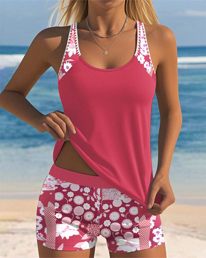 Women's floral tankini swimsuit with matching swim shorts, perfect for a beach vacation.