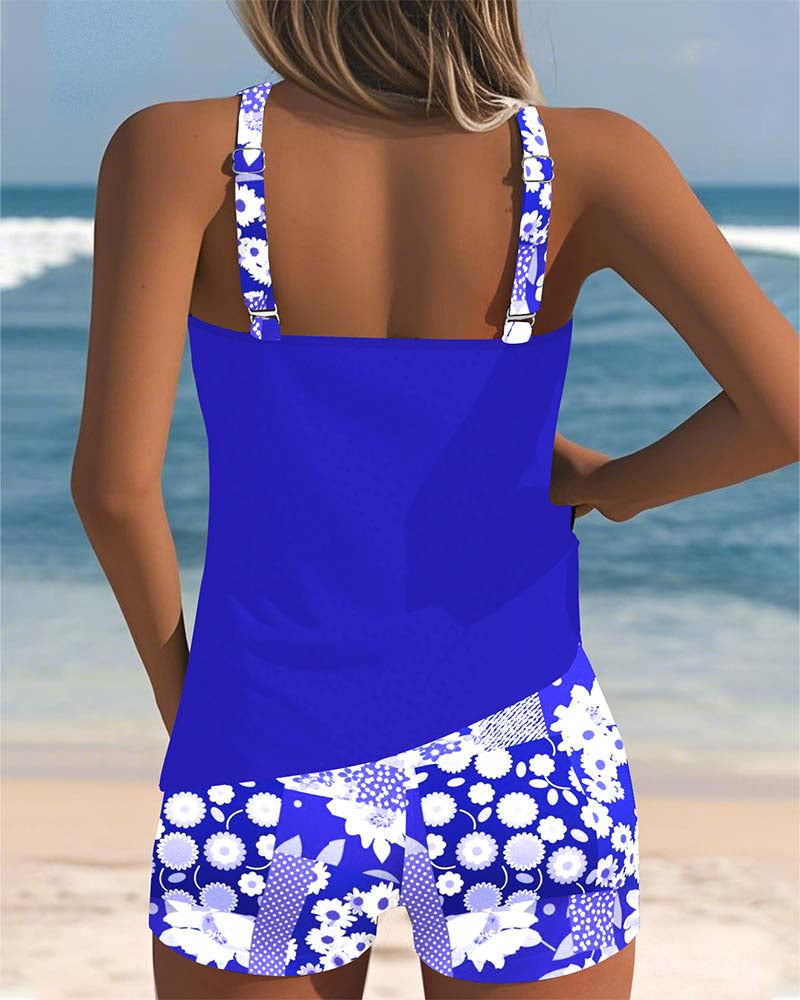 Tankini swimsuit for women featuring a floral print top & comfortable swim shorts. Ready for vacation.
