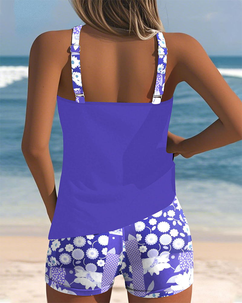 Enjoy your beach vacation in this vibrant floral tankini swimsuit with comfy swim shorts. Women's swimwear.