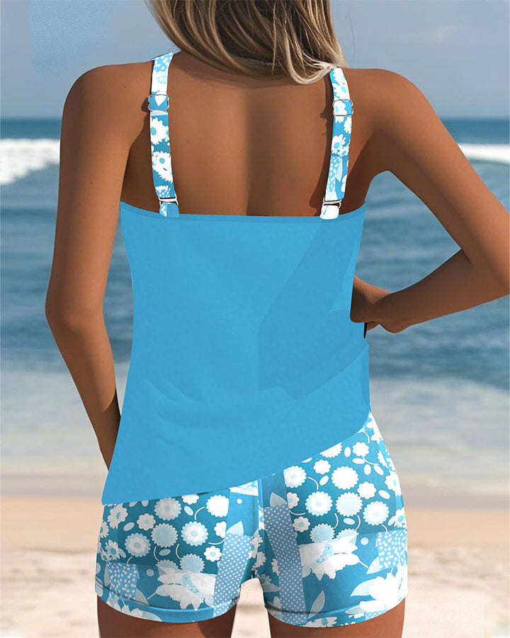 Women's floral tankini with swim shorts. Two-piece beachwear & swimwear for summer vacation outfit.