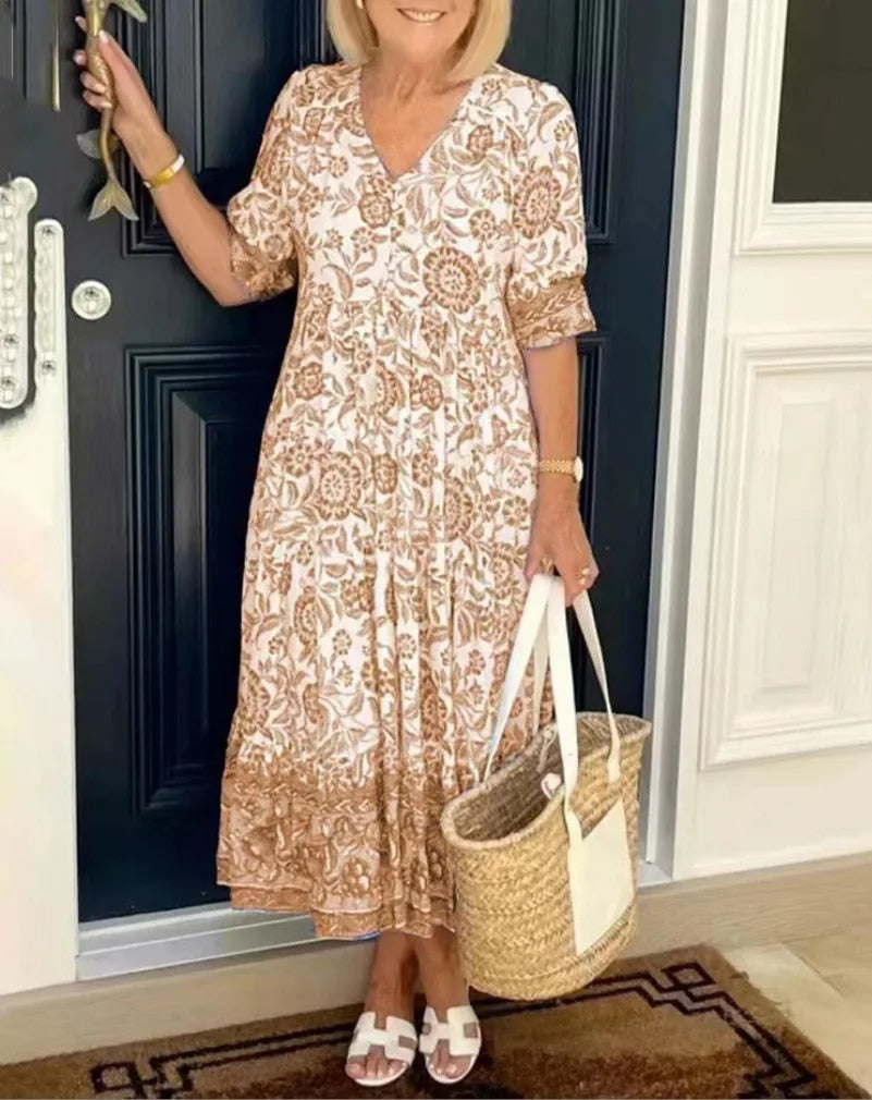 Chic women's V-neck floral A-line midi dress, embodying stylish, comfortable spring & summer fashion.