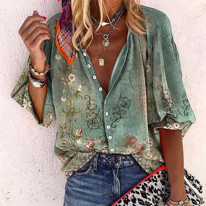 Women's floral V-neck blouse with button front, short sleeves. Casual bohemian summer top.