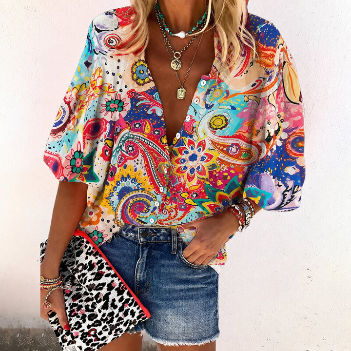 Feminine bohemian floral V-neck blouse, short sleeve, perfect for spring/summer casual wear.