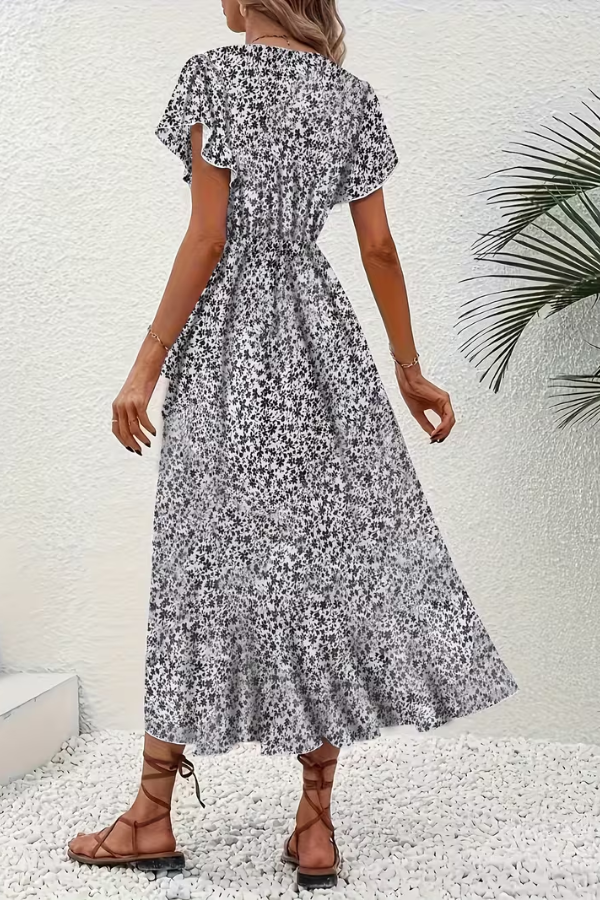 Vibrant floral print V-neck dress for women, elegant summer style for any occasion.