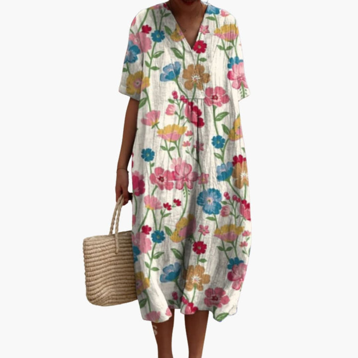 Women's floral V-neck midi dress with short sleeves, oversized and flowy for summer casual wear.
