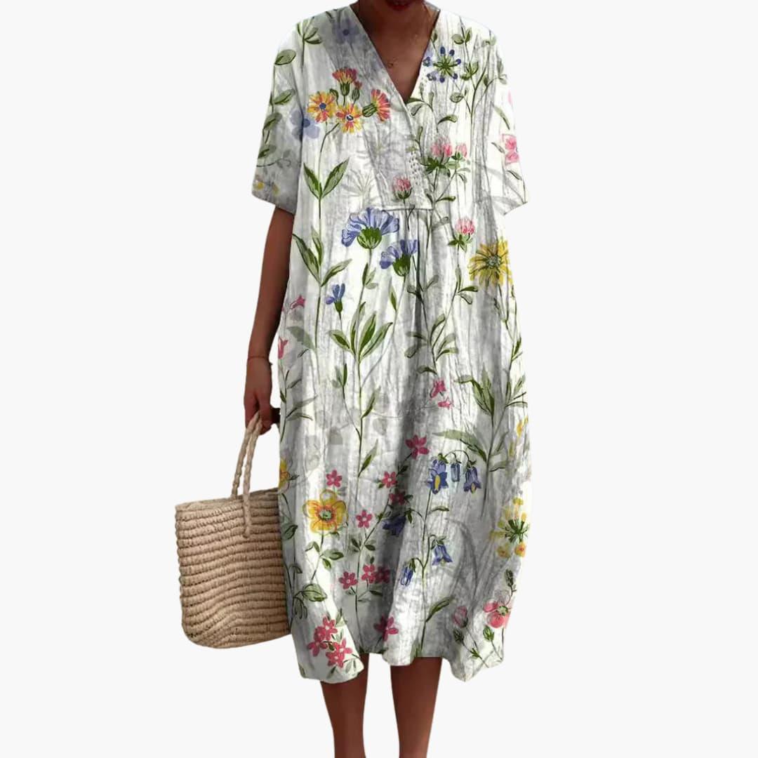 Vibrant floral print women's V-neck midi dress, short sleeves, loose oversized for casual summer days.
