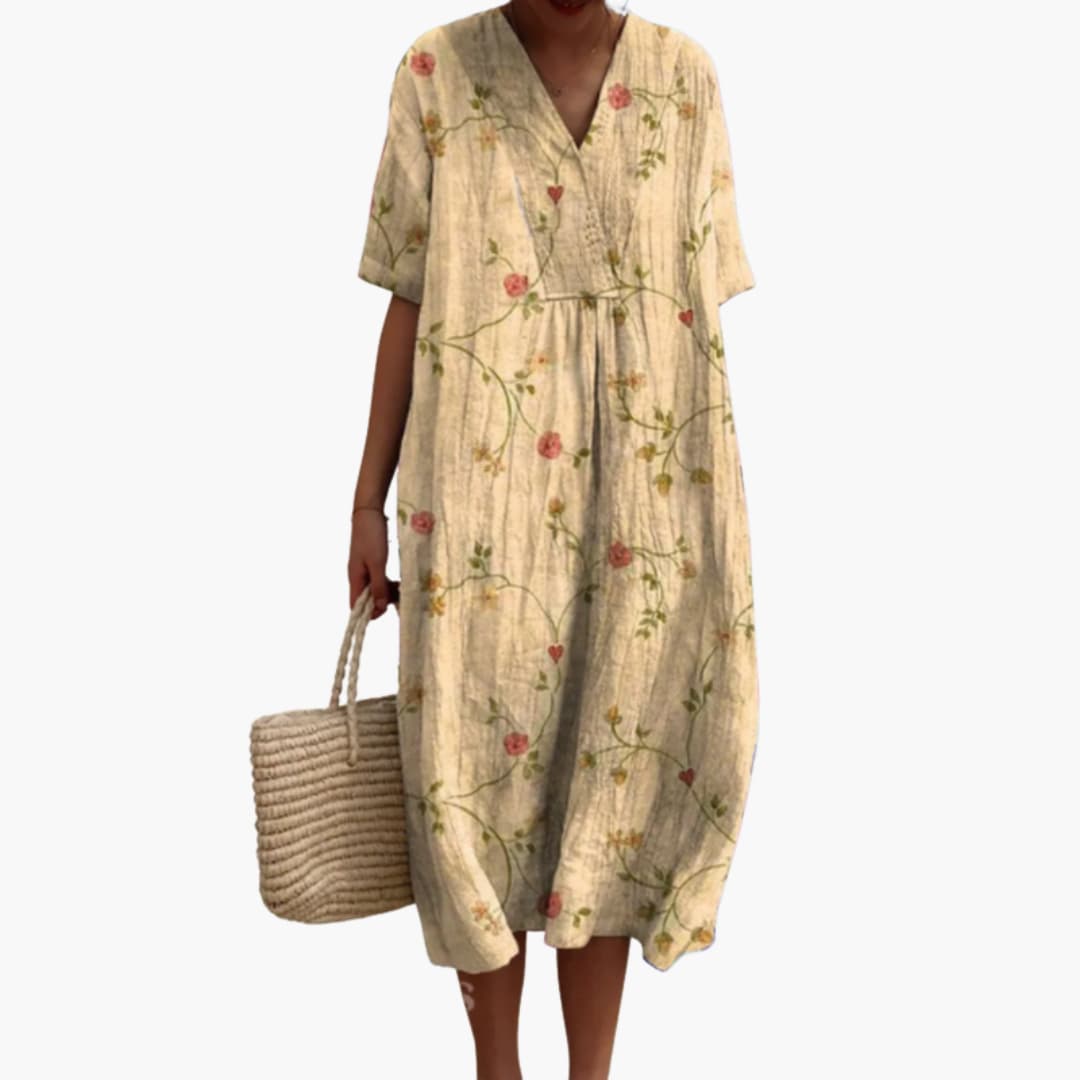 Versatile women's floral midi dress, V-neck, oversized fit, and pockets for everyday or vacation.