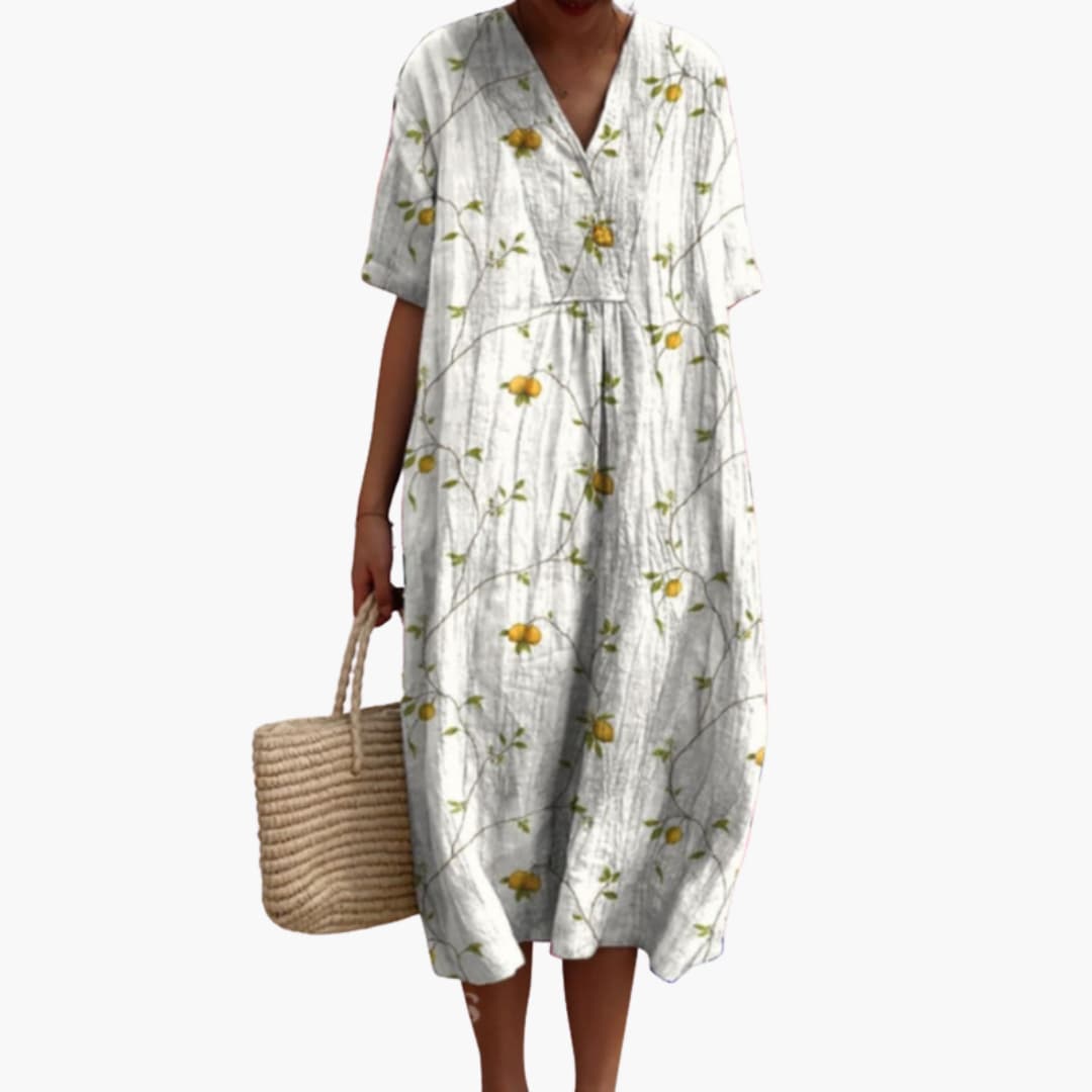 Chic women's floral V-neck oversized midi dress offering comfort, style, and convenient pockets.