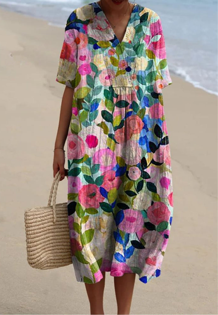 Women's floral V-neck short sleeve midi dress with an oversized, relaxed fit, perfect for summer casual wear.
