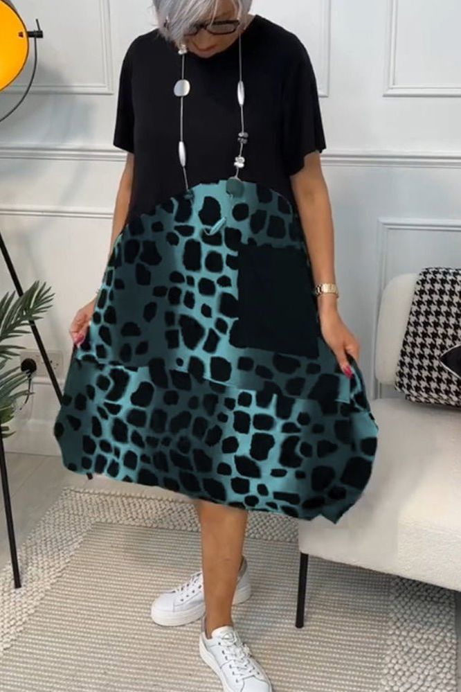 Close-up of Women's Floral Waist-Defined Midi Dress fabric, showcasing elegant floral pattern.