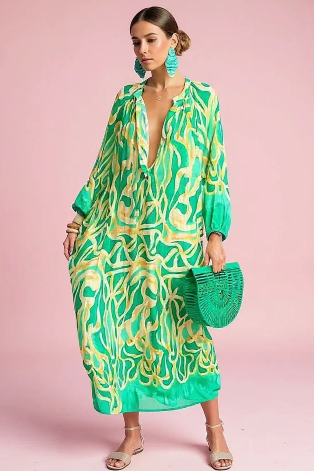 Women's flowing abstract print V-neck kaftan maxi dress. Perfect for resort wear or a stylish summer outfit.
