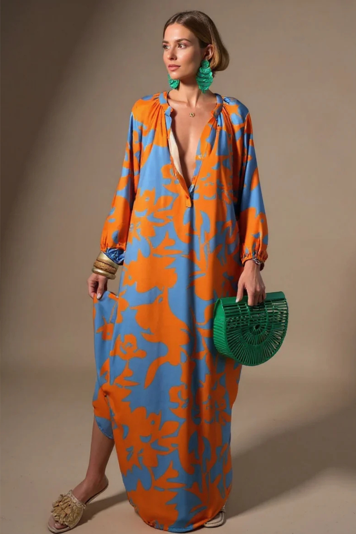 Stylish women's abstract print kaftan maxi dress with a V-neck, ideal for resort wear or a beach vacation.