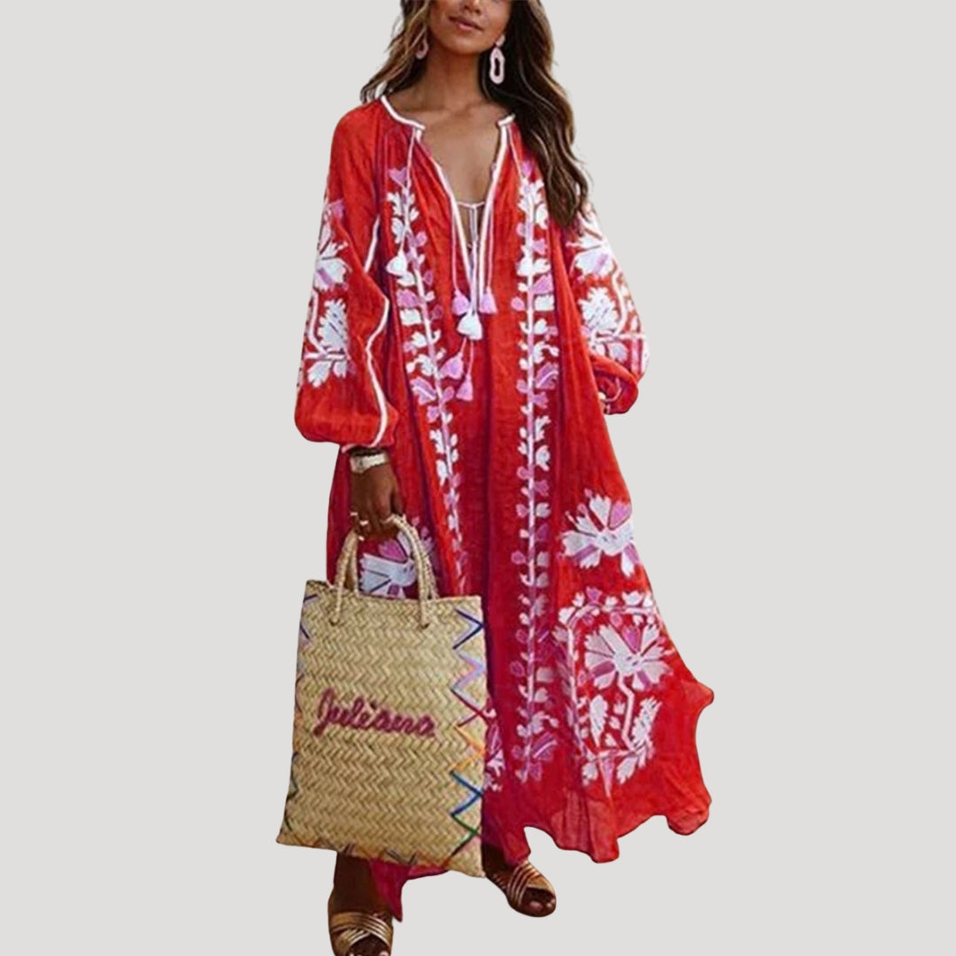 Women's flowing boho maxi dress with V-neck, long sleeves, & vibrant bohemian pattern, perfect for summer casual style.