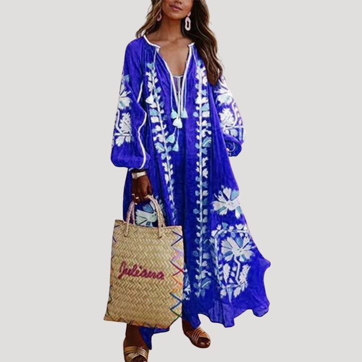 Bohemian V-neck maxi dress for women, featuring long sleeves & a loose, patterned, flowing fit for comfortable spring wear.