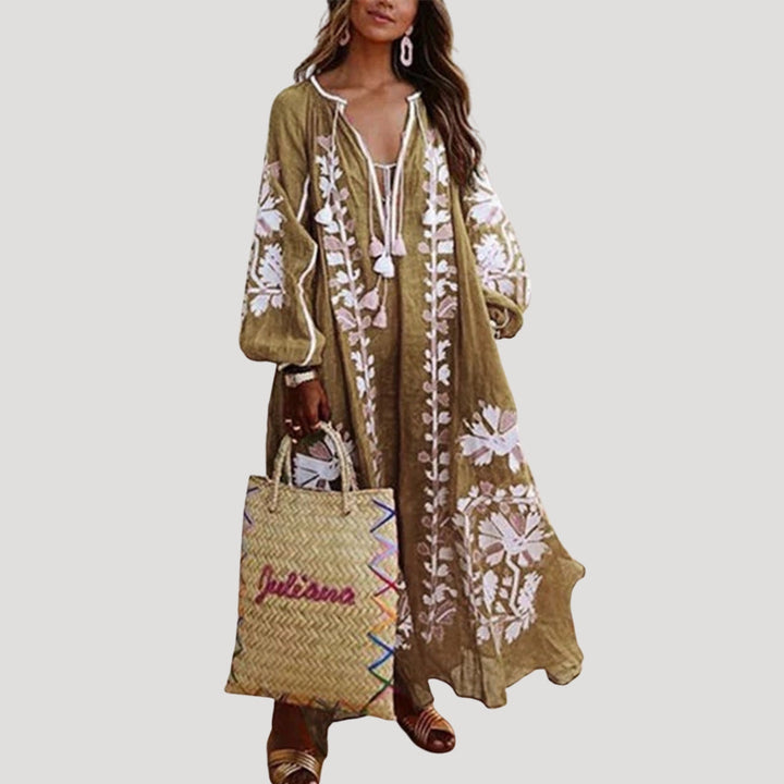 Elegant patterned maxi dress for women, boasting a V-neck, long sleeves, & free-flowing bohemian design for spring/summer.