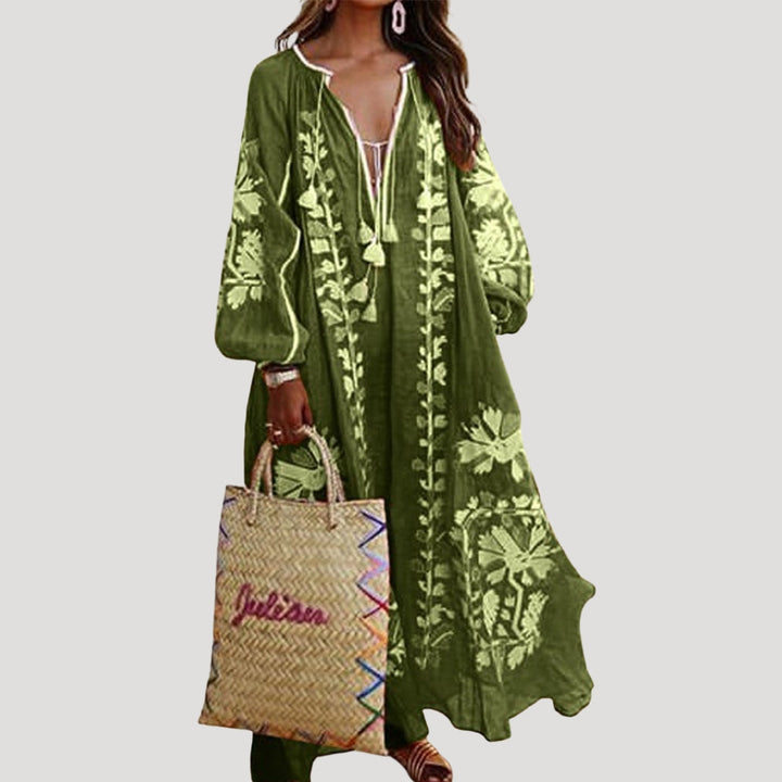 Stylish bohemian long-sleeve maxi dress for women. Features a flattering V-neck & an eye-catching, flowing patterned design.