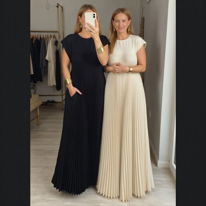 Long flowing pleated maxi dress for women. Elegant, comfortable, & versatile, perfect for modern fashion.