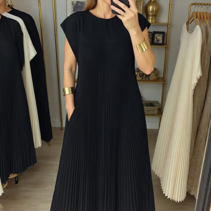 Sophisticated women's pleated maxi dress. Flowing design offers comfort & elegance for versatile occasions.