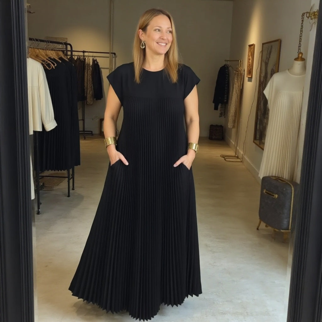 Classic women's flowing maxi dress with elegant pleats. Versatile, comfortable & chic for any event.