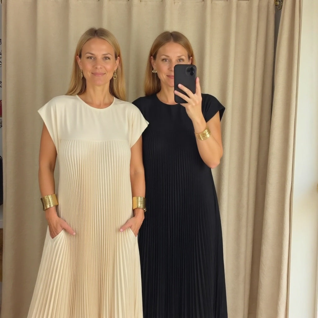 Graceful women's long pleated maxi dress. Flowing fabric ensures comfort, pleats add elegant style.