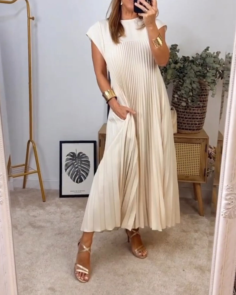 Women's elegant pleated maxi dress. Flowing silhouette for comfort & versatile style in modest fashion.