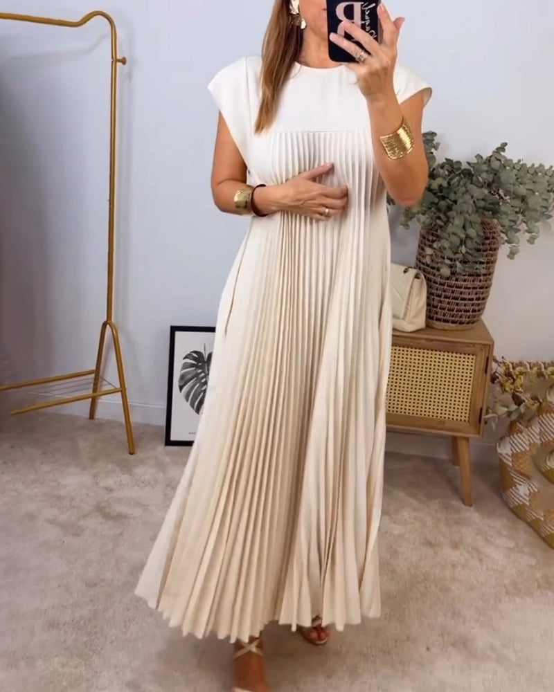 Beautiful women's flowing pleated maxi dress. Chic, comfortable & versatile for elegant social occasions.