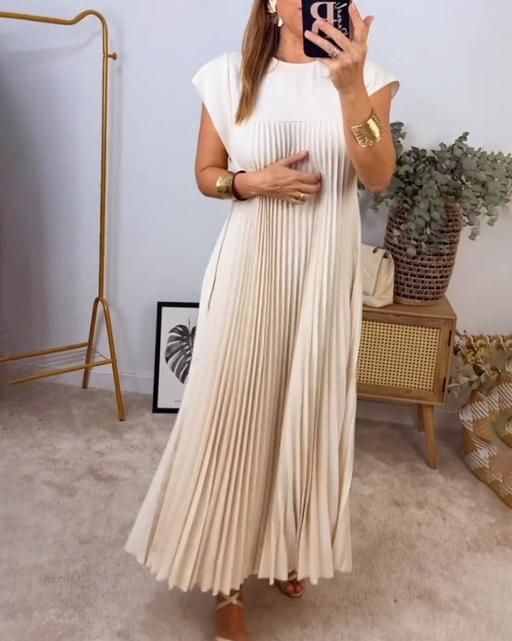 Beautiful women's flowing pleated maxi dress. Chic, comfortable & versatile for elegant social occasions.