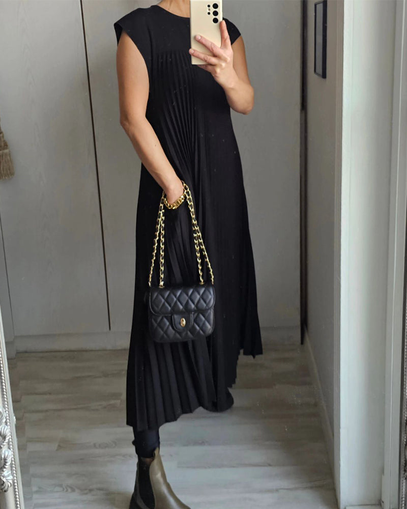 Women's elegant flowing pleated maxi dress. Comfortable, versatile, & chic for any special occasion.