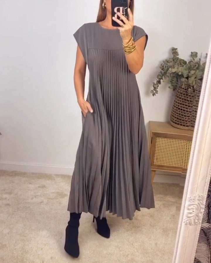 Elegant women's long pleated maxi dress, designed for versatile styling & comfortable wear. Modest fashion.