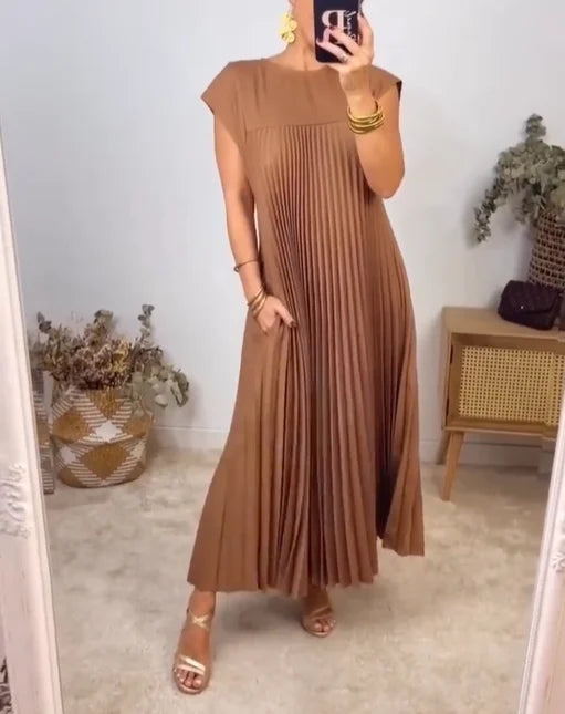 Timeless women's flowing maxi dress with delicate pleats. Chic & comfortable for any elegant event.