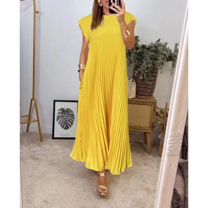Versatile women's pleated maxi dress, offering graceful flow & elegant look. Ideal for various occasions.