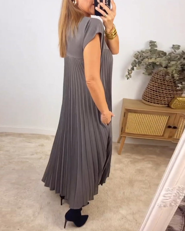 Modest women's flowing pleated maxi dress. Elegant, comfortable, & versatile long dress for chic style.