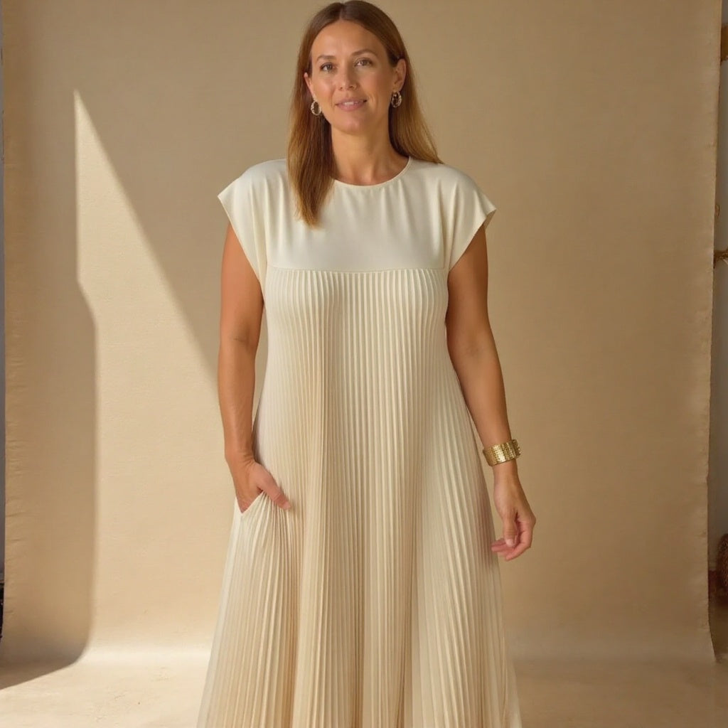 Elegant flowing pleated maxi dress for women. Timeless design, comfortable wear, & versatile for occasions.
