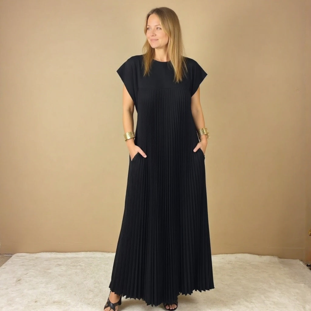 Women's chic pleated maxi dress with beautiful flow. Versatile, comfortable, & elegant for any event.