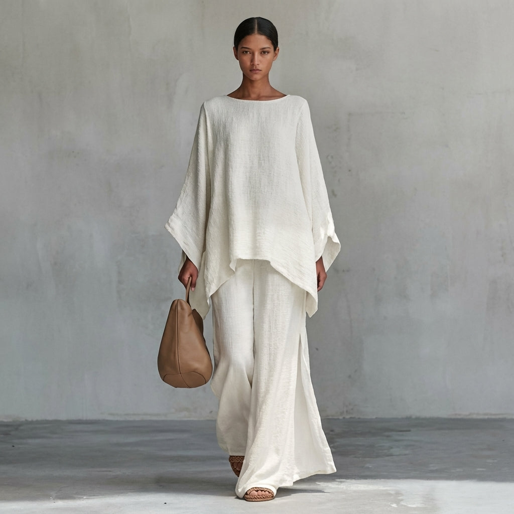 Women's flowing two-piece set with an oversized tunic top and a matching maxi skirt. Perfect for resort wear.