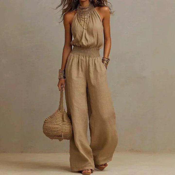 Women's flowing wide leg halter jumpsuit, perfect for summer vacation or elegant casual wear.